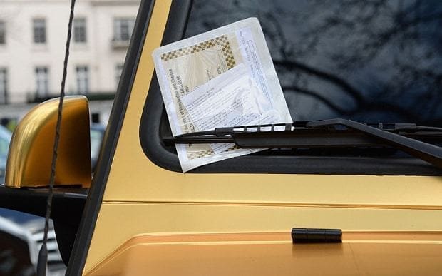 A parking ticket placed on a 6x6 Mercedes G 63 from Saudi Arabia، which is one of three gold cars parked on Cadogan Place in Knightsbridge، London. PRESS ASSOCIATION Photo. Picture date: Wednesday March 30، 2016. See PA story TRANSPORT Knightsbridge. Photo credit should read: Stefan Rousseau/PA Wire